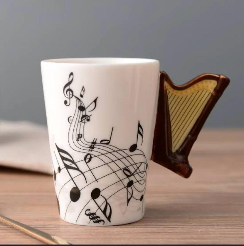 White ceramic music note mug with 3D harp handle in brown and gold