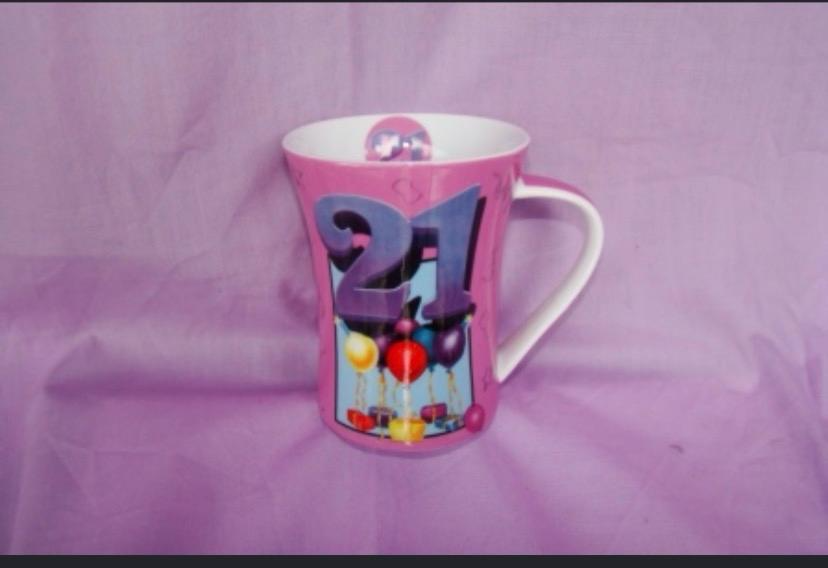 21st birthday pink ceramic mug with colourful balloon design and disco ball detail