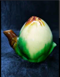 Ceramic flower bud artichoke shaped teapot in green cream and brown glaze