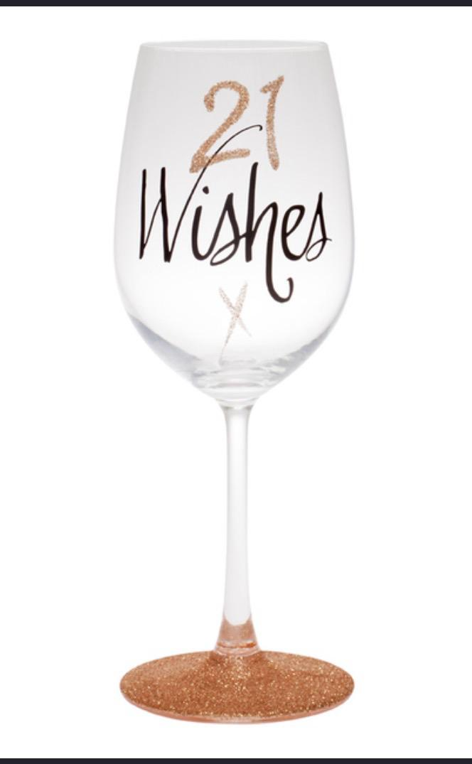 21 Wishes wine glass with black script lettering and rose gold glitter base